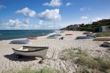 Boats,On,White,Sand,Beach,And,Town,Behind,,Tisvilde,,Kattegat