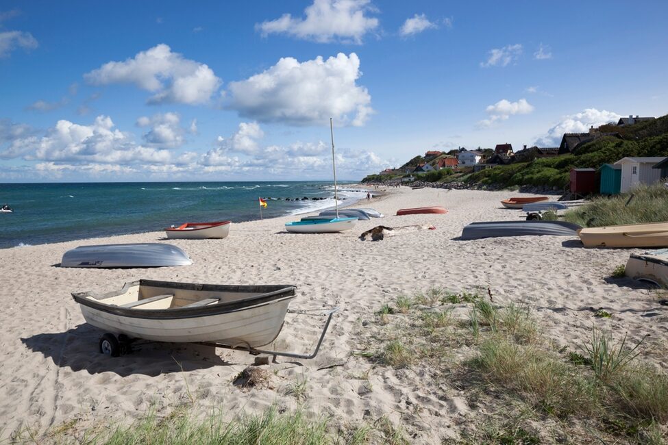 Boats,On,White,Sand,Beach,And,Town,Behind,,Tisvilde,,Kattegat