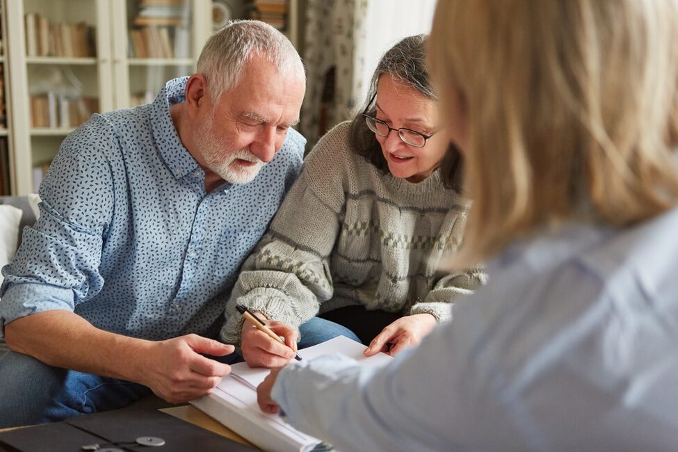 Senior,Couple,Signs,A,Contract,Or,Power,Of,Attorney,Or